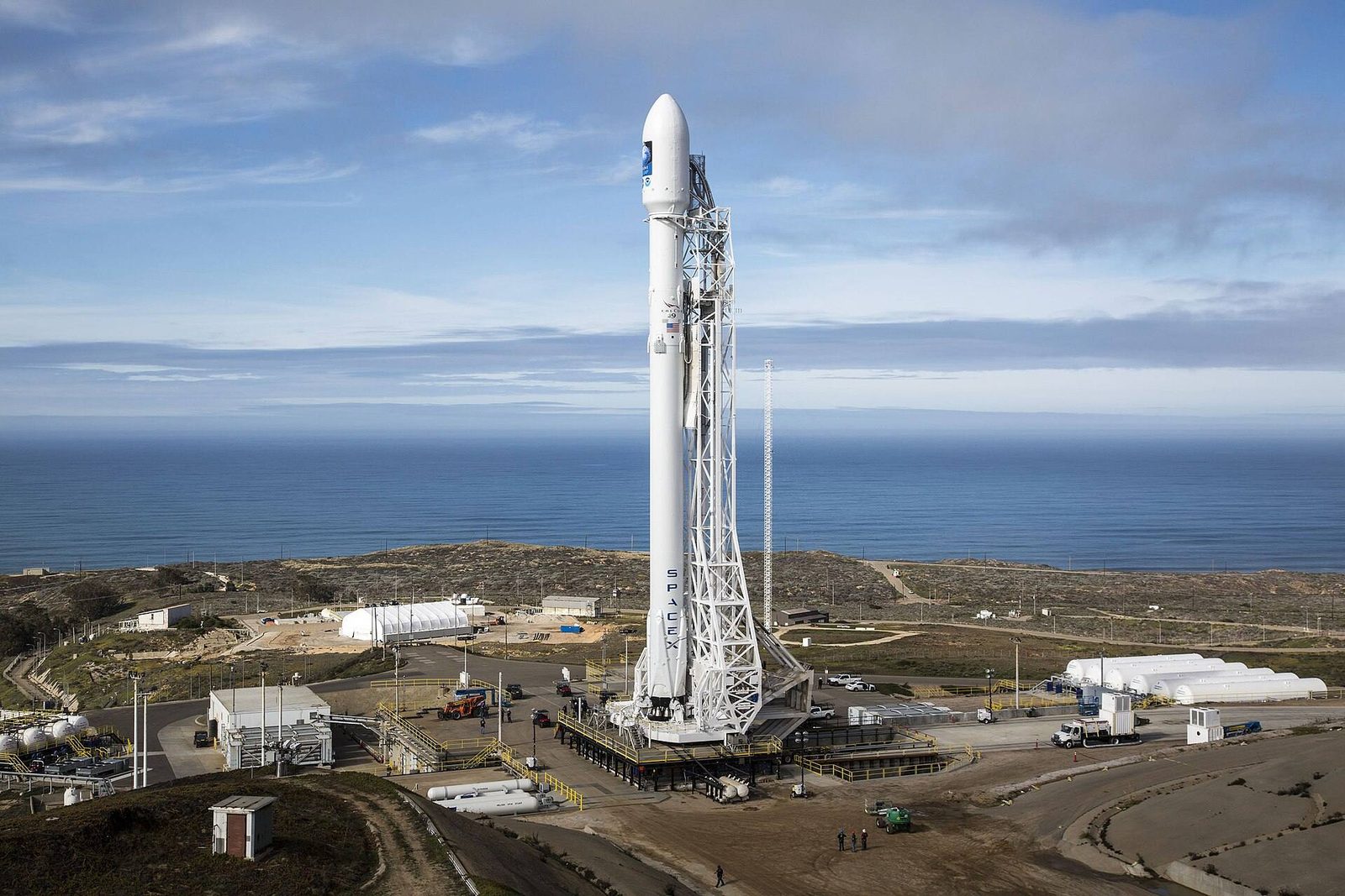 A Falcon 9 stands vertical at Vandenberg's SLC-4E. The Transporter-18 flight was the 110th Falcon 9 mission of 2026.